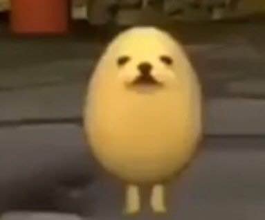 Small yellow chick standing upright with a simple facial expression.