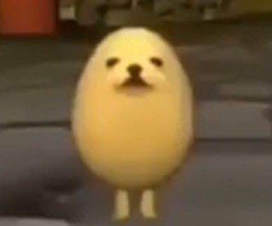 "Viral blurry eggdog meme: a yellow egg-shaped cartoon dog with a canine face and tiny legs stand...