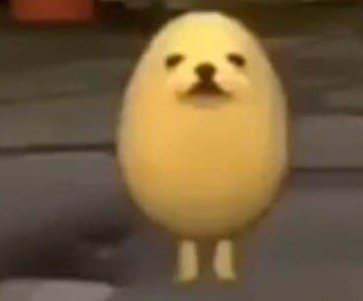 Blurry screenshot of the viral Eggdog meme, an egg-shaped yellow dog character standing upright w...