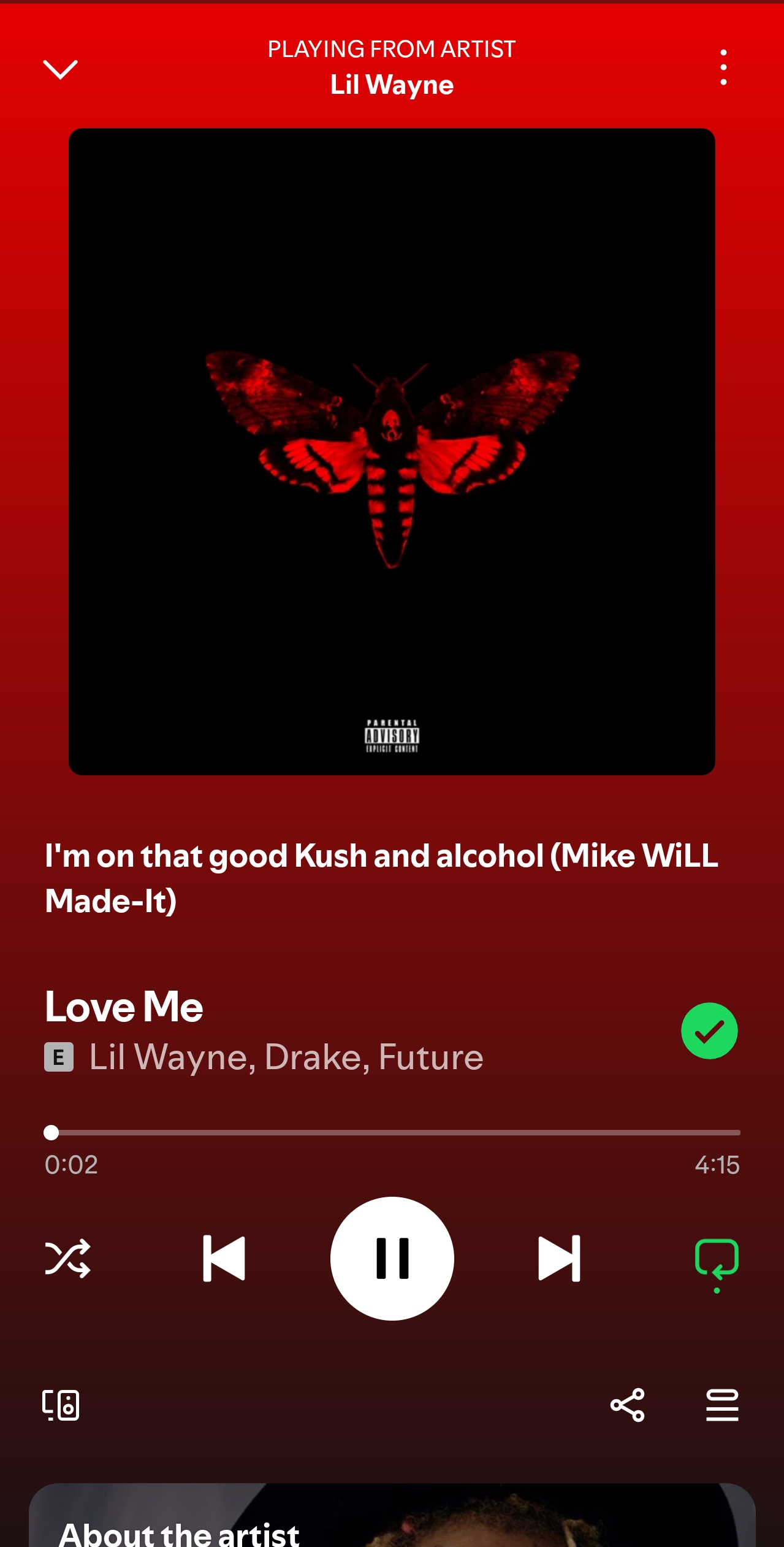 Album cover on a red-tade music player screen featuring a black square with a red butterfly/moth design.