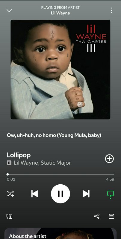 Album cover featuring a baby in a light blue suit with facial tattoos and jewelry, Lil Wayne’s Th...