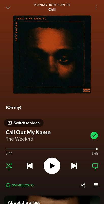 Dark Spotify screen featuring The Weeknd’s album cover with a moody, orange-tinted gradient backg...
