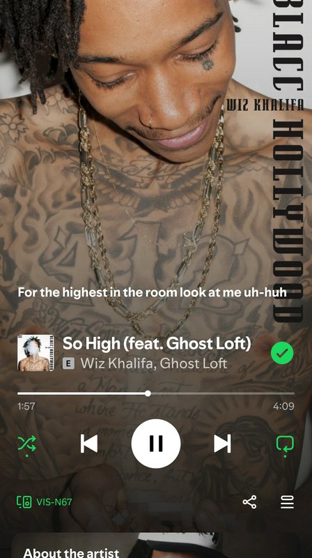 Spotify-style music interface playing Wiz Khalifa's "So High (feat. Ghost Loft)" over a portrait ...