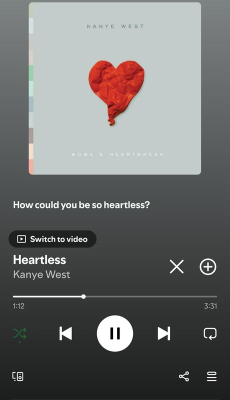 Mobile music streaming interface playing Kanye West’s Heartless, showing 808s & Heartbreak album ...