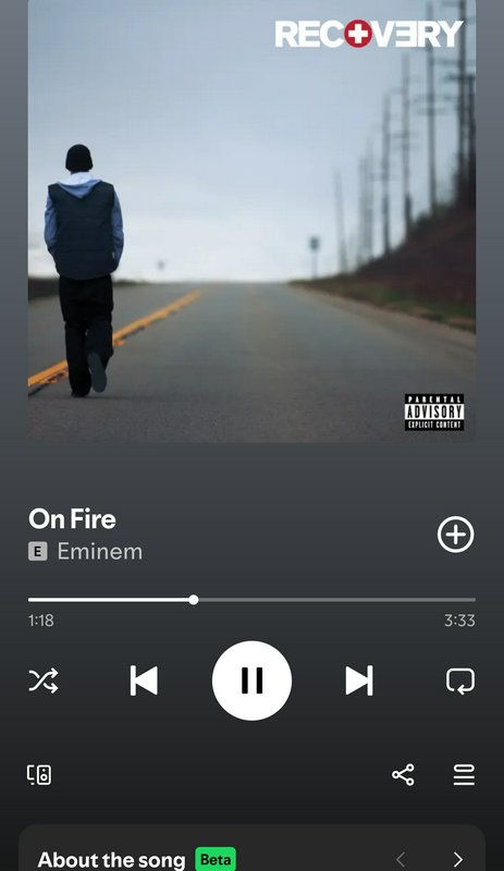 Spotify mobile player interface playing Eminem's "On Fire" from the Recovery album, displaying of...