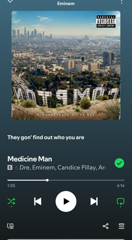 Mobile Spotify player showing Dr. Dre's Compton album art for the track Medicine Man featuring Em...