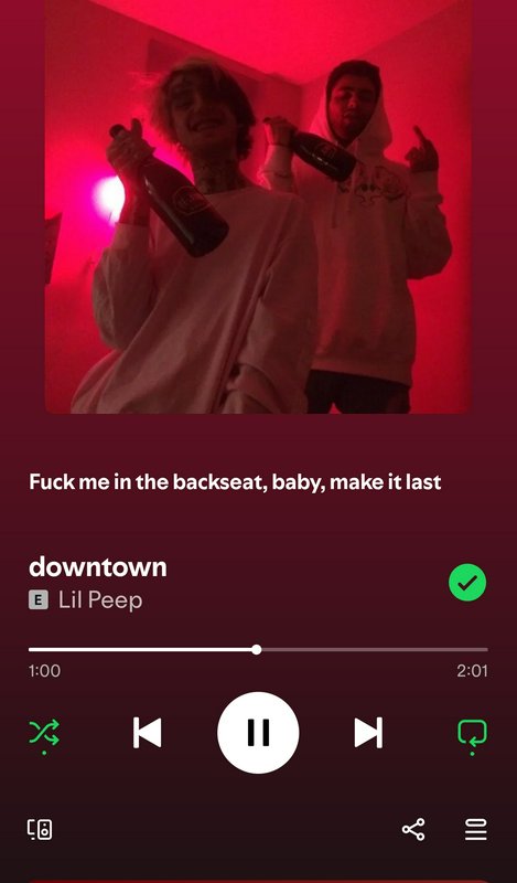 Screenshot of Spotify playing Lil Peep's "downtown", red-lit album art of Lil Peep holding a bott...