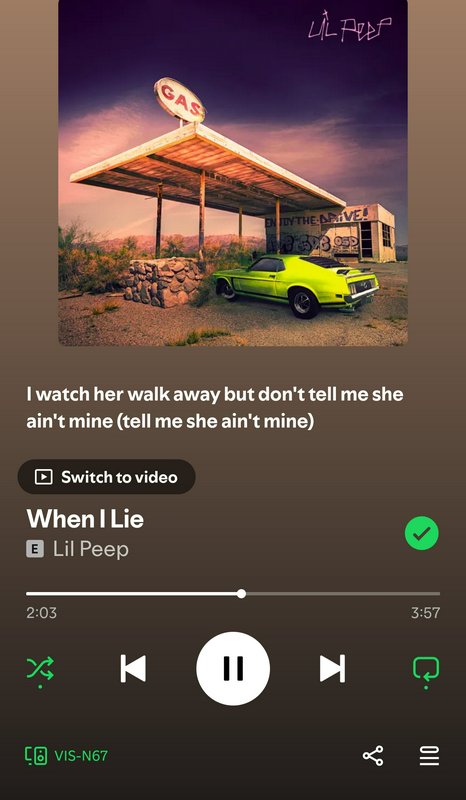 Spotify playback screen for Lil Peep's track When I Lie, showing album art of a desert gas statio...