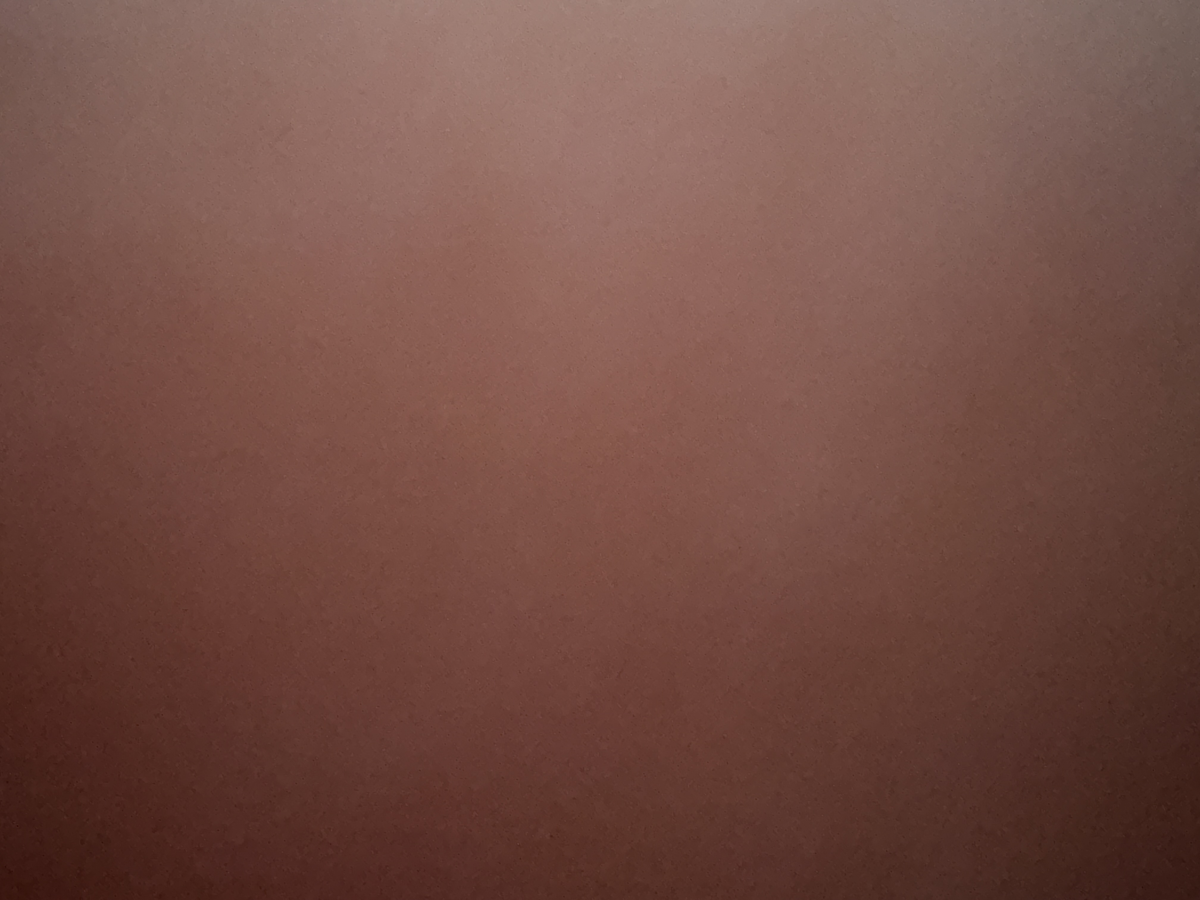 Solid brown background with a subtle texture and soft gradient.