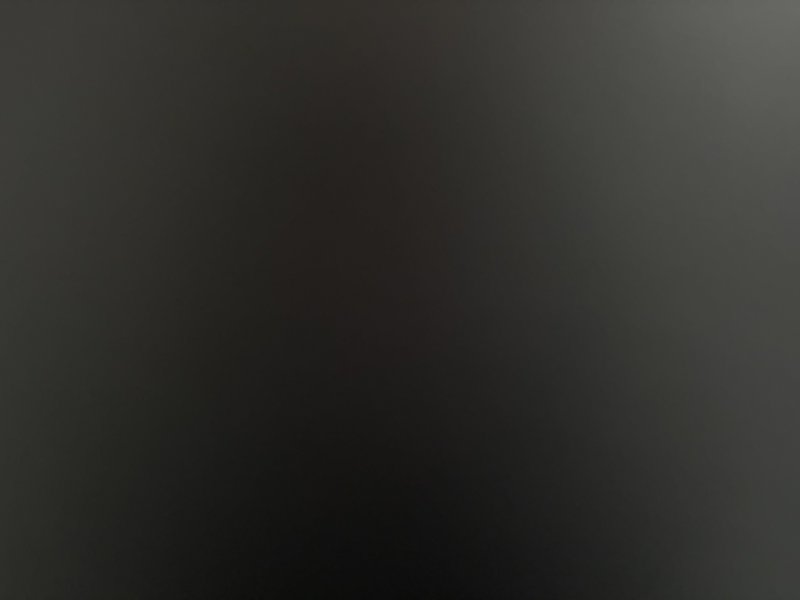 Dark abstract gradient background with a subtle, smooth transition to black