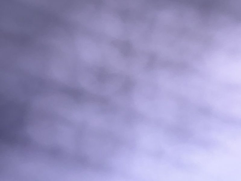 Soft purple cloudy sky with wispy, diffuse clouds.