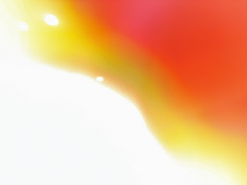 Abstract bright gradient with yellow to red hues and white flare in the lower left.